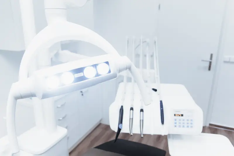 A bright dental operatory with the chair and lamp ready